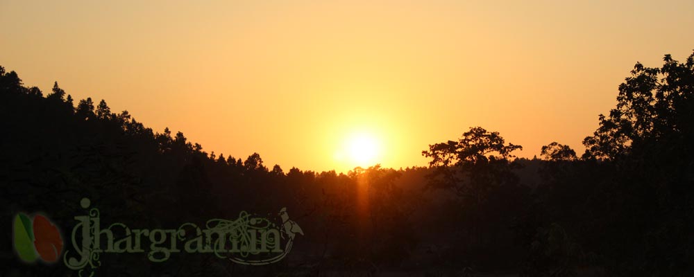 Sunset over forested plateau